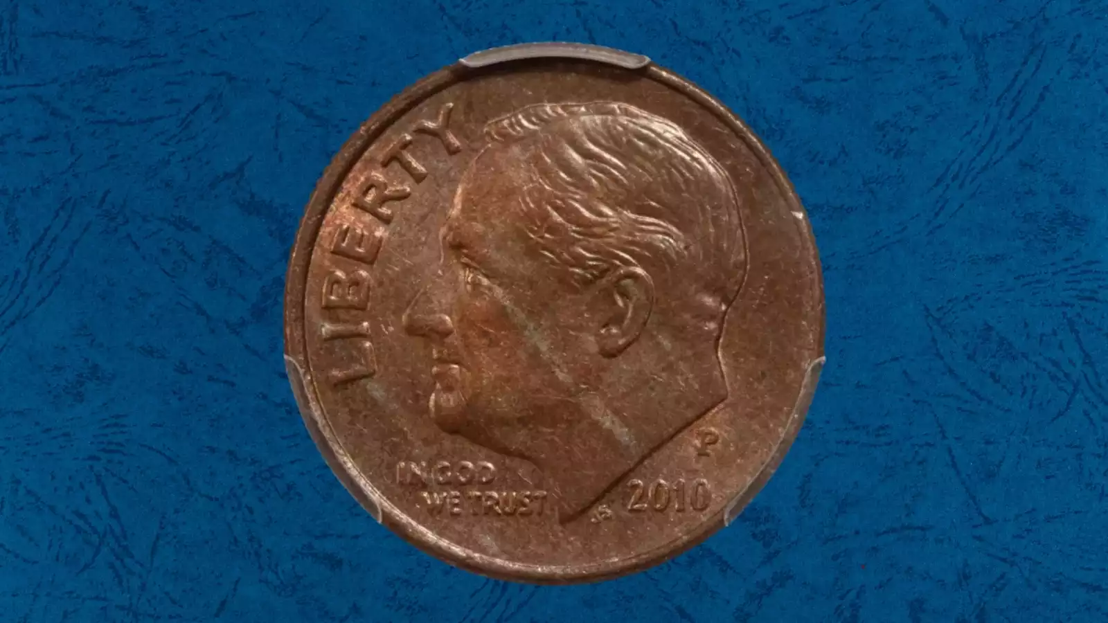 2010 Roosevelt dime missing clad layer error showing exposed copper core on the reverse side