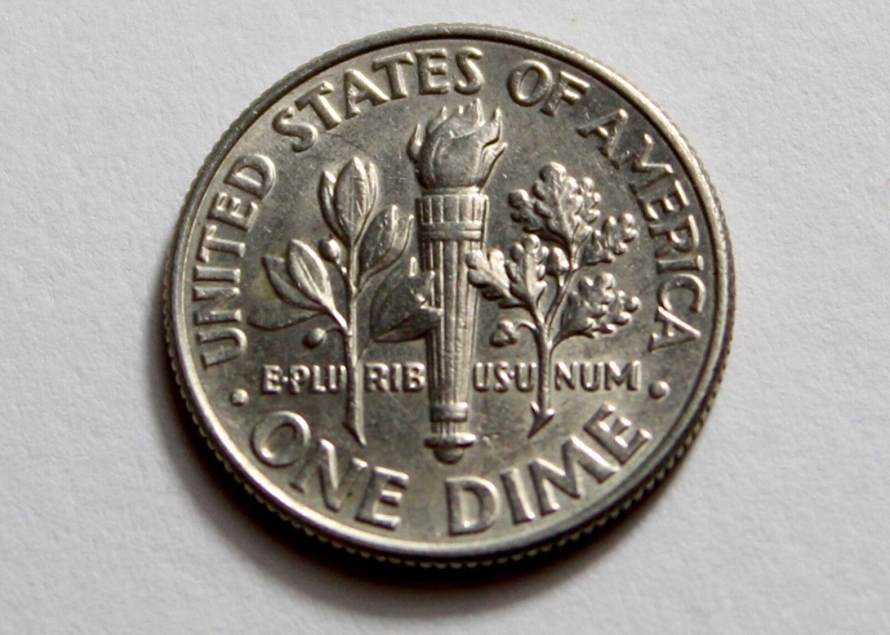 2010 Roosevelt dime rim cud error showing raised blob of metal at the coin's rim from a die break